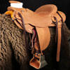 The Rough-Out Rough Rider - Colt Starter, Wade Tree, 15 and 1/2 inch seat, Gullet - 7 and 1/2 inch by 6 and 1/4 inch by 4 inch, Horn 4 and 1/4 by 4 inch Guatelajara, 92 degree bars, 7/8ths flat palte riggin, Cheyenne Roll, built by Keith Valley.